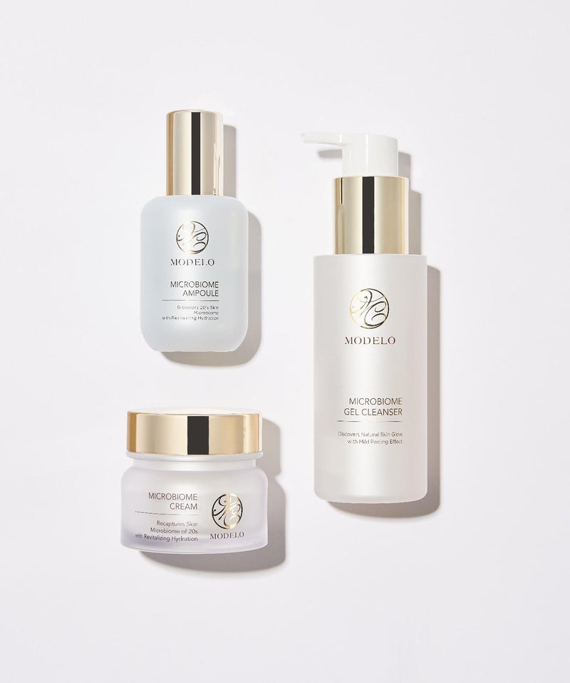 Trei produse MODELO Microbiome — gel de curățare, esență și cremă